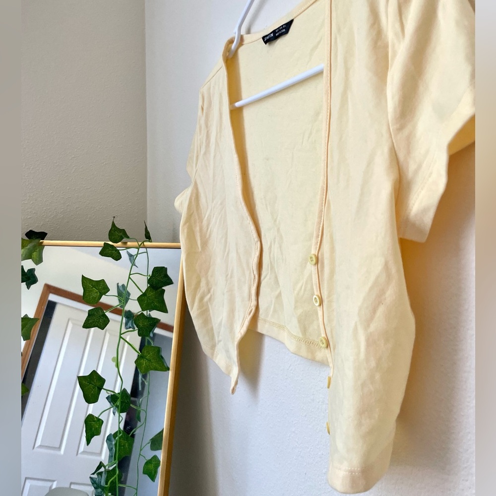 s yellow button up top